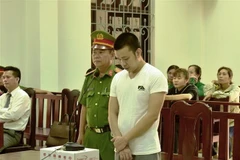 Bị cáo Lâm Trung Kiên nghe tuyên án. (Ảnh: Thanh Tân/TTXVN)