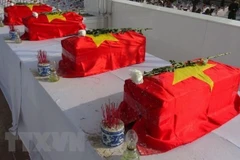 An táng hài cốt liệt sỹ. (Ảnh minh họa. Nguồn: TTXVN)