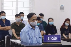 Bị cáo Phùng Đức Lợi tại phiên tòa. (Nguồn: nld.com.vn)