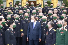 Chủ tịch nước Nguyễn Xuân Phúc với các đại biểu tại buổi gặp mặt. (Ảnh: Thống Nhất/TTXVN)