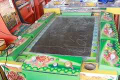 Máy game bắn cá đang bị tạm giữ để chờ xử lý tại Bình Dương. (Ảnh: Dương Chí Tưởng/TTXVN)
