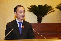 Chủ nhiệm Ủy ban Kinh tế của Quốc hội Vũ Hồng Thanh trình bày Báo cáo, giải trình, tiếp thu, chỉnh lý dự án Luật sửa đổi bổ sung một số điều của Luật Các tổ chức tín dụng. (Ảnh Nguyễn Dân/TTXVN)