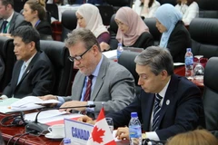 Bộ trưởng Thương mại quốc tế Canada Francois-Philippe Champagne (bên phải) dự Hội nghị Bộ trưởng TPP. (Ảnh: TTXVN)