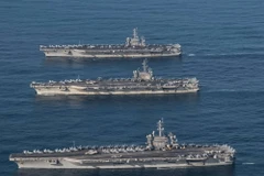 Tàu sân bay USS Ronald Reagan, Theodore Roosevelt và Nimitz của Mỹ tham gia một cuộc tập trận. (Nguồn: Yonhap/TTXVN)