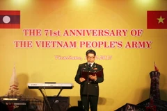 ​Lễ kỷ niệm 71 năm ngày thành lập Quân đội Nhân dân Việt Nam tại Lào. (Ảnh: Phạm Kiên/Vietnam+)