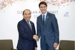 Thủ tướng Nguyễn Xuân Phúc gặp Thủ tướng Canada Justin Trudeau. (Ảnh: Thống Nhất/TTXVN)