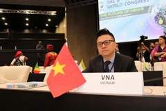 Phó Tổng giám đốc TTXVN Lê Quốc Minh tham dự Lễ khai mạc NAWC lần thứ 6. (Ảnh: Ngọc Biên/TTXVN)