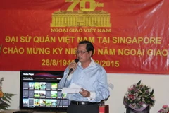 Đại sứ Việt Nam tại Singapore Nguyễn Tiến Minh điểm lại những thành tích của Đại sứ quán đã đạt được trong việc thúc đẩy quan hệ đối tác chiến lược Việt Nam-Singapore (Ảnh: Việt Hải, Mỹ Bình, Lê Hải/Vietnam+)