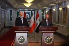 Ngoại trưởng Iraq Mohammed al-Hakim (phải) trong cuộc họp báo chung với người đồng cấp Iran Mohammad Javad Zarif tại Baghdad ngày 13/1/2019. (Nguồn: THX/TTXVN) 