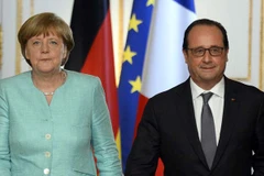 Thủ tướng Đức Angela Merkel và Tổng thống Pháp Francois Hollande. (Nguồn: AFP)