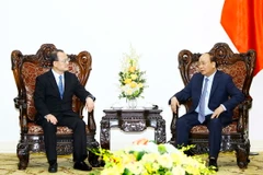 Tại Trụ sở Chính phủ, Thủ tướng Nguyễn Xuân Phúc tiếp Chủ tịch tập đoàn Sunwah H​ong Kong Jonathan Choi. (Ảnh: An Đăng/TTXVN)