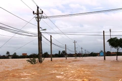 Huyện Lệ Thủy ngập chìm trong nước. (Ảnh: Võ Dung/TTXVN)