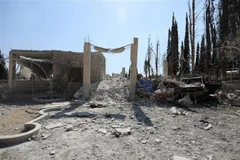 Hiện trường một vụ không kích ở Tây Bắc Syria. (Nguồn: AFP/TTXVN) 