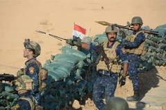 Các lực lượng Iraq làm nhiệm vụ trong chiến dịch truy quét IS. (Nguồn: AFP/TTXVN) 