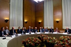 Các đại biểu tham giam cuộc đàm phán hạt nhân tại Palais des Nations ở thủ đô Geneva, Thụy Sĩ ngày 24/11. (Nguồn: THX/TTXVN)