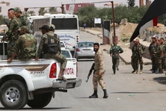 Các lực lượng Syria tăng cường an ninh tại Damacus ngày 9/4. (Nguồn: AFP/TTXVN)