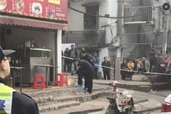 Cảnh sát điều tra hiện trường vụ án. (Nguồn: people.com.cn)