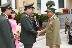 Đại tướng, Bộ trưởng Bộ Công an Tô Lâm đón Thượng tướng, Bộ trưởng Bộ An ninh Lào Vilay Lakhamphong. (Ảnh: Doãn Tấn/TTXVN)