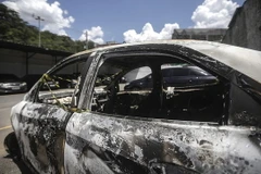 Thi thể bị đốt cháy của ông Amiridis được phát hiện trong chiếc xe ôtô cháy đen. (Nguồn: EPA)