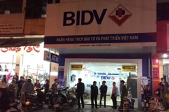 Chi nhánh ngân hàng BIDV bị cướp. (Ảnh Hồ Cầu/TTXVN)