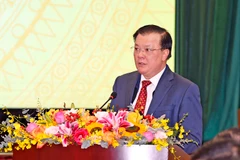 Bộ trưởng Bộ Tài chính Đinh Tiến Dũng phát biểu tại hội nghị, ngày 8/1. (Ảnh: Vietnam+)