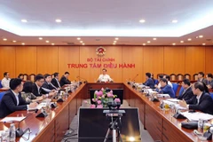 Bộ trưởng Đinh Tiến Dũng chủ trì buổi làm việc. (Ảnh: Vietnam+)