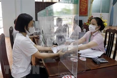 Ngân hàng Chính sách Xã hội tỉnh Bắc Giang giải ngân vốn vay ưu đãi theo Nghị quyết 11 của Chính phủ. (Ảnh: Đồng Thúy/TTXVN)