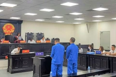Phiên tòa xét xử hai bị cáo là luật sư lừa đảo chiếm đoạt 3,2 tỷ đồng của khách hàng. (Nguồn: báo Công an Nhân dân)