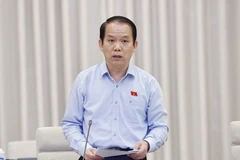 Chủ nhiệm Ủy ban Pháp luật của Quốc hội Hoàng Thanh Tùng trình bày báo cáo. (Ảnh: Doãn Tấn/TTXVN)