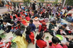 Chương trình “Hội vui bánh chưng xanh-Tết an lành” là một trong những hoạt động ý nghĩa thiết thực tạo điều kiện cho các học sinh có trải nghiệm thú vị, bổ ích. (Ảnh: Minh Quyết/TTXVN)