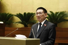Bộ trưởng Bộ Tài chính Hồ Đức Phớc trình bày Tờ trình về việc chuyển nguồn kinh phí công tác phòng, chống dịch COVID-19 năm 2021 của các địa phương sang niên độ ngân sách năm 2022. (Ảnh: An Đăng/TTXVN)