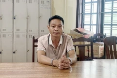 Đối tượng Lê Thiện Duy tại cơ quan Công an. (Nguồn: báo Công an Nhân dân)