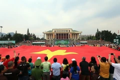 [Photo] Lễ thượng cờ Tổ quốc ở giải vô định quốc gia Marathon 2023 