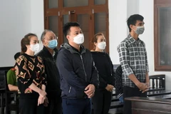 Các bị cáo tại phiên xét xử sơ thẩm. (Ảnh: TTXVN phát)