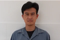 Đối tượng Nguyễn Thành Nguyễn tại cơ quan điều tra. (Ảnh: TTXVN phát)