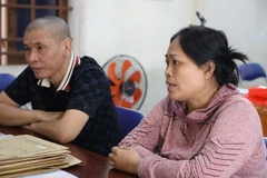 Hai đối tượng Trần Kim Phượng và Vũ Đức Hiền bị tạm giữ hình sự tại cơ quan công an. (Ảnh: Thanh Tân/TTXVN)