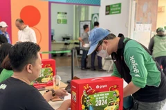 Gojek tri ân nỗ lực bền bỉ của các đối tác tài xế bằng chuỗi hoạt động đón Tết đầy ý nghĩa. (Ảnh: PV/Vietnam+)