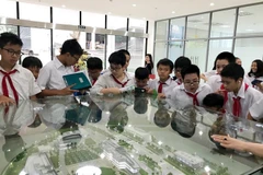 Các em nhỏ hào hứng khi tham gia SpaceDay 2017 của Trung tâm Vệ tinh Quốc gia. (Ảnh minh họa: CTV/Vietnam+)