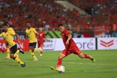 Pha dứt điểm của tiền đạo Anh Đức (số 11), nâng tỷ số lên 2-0 cho Việt Nam ở phút 59. (Ảnh: Trọng Đạt/TTXVN)