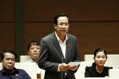 Bộ trưởng Bộ Lao động, Thương binh và Xã hội Đào Ngọc Dung trả lời chất vấn của đại biểu Quốc hội chất vấn về thực trạng trục lợi chính sách, quá trình xét người có công. (Ảnh: Văn Điệp/TTXVN)
