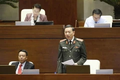 Bộ trưởng Bộ Công an Tô Lâm phát biểu làm rõ một số vấn đề đại biểu Quốc hội nêu. (Ảnh: Doãn Tấn/TTXVN)