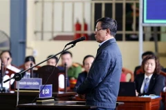 Bị cáo Phan Văn Vĩnh, nguyên Tổng cục trưởng Tổng cục cảnh sát trả lời trước tòa. (Ảnh: Trung Kiên/TTXVN)