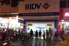 Chi nhánh ngân hàng BIDV bị cướp. (Ảnh Hồ Cầu/TTXVN)