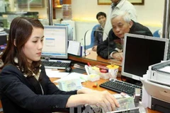Sacombank triển khai gói tài khoản an sinh xã hội miễn phí. (Ảnh: Vietnam+)