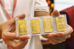 Vietcombank triển khai tiện ích đăng ký mua vàng miếng SJC trực tuyến. (Ảnh: Vietnam+)