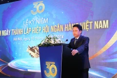 Phó Thống đốc Ngân hàng Nhà nước Phạm Tiến Dũng phát biểu tại lễ kỷ niệm. (Ảnh: Vietnam+)