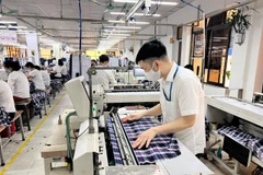 Standard Chartered dự báo GDP quý 2 sẽ ở mức vừa phải trong bối cảnh lạm phát gia tăng. (Ảnh: Vietnam+)