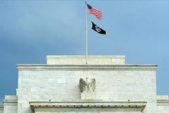 Fed tiếp tục cắt giảm gói cứu trợ nhưng chưa tăng lãi suất cơ bản