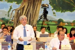 Bộ trưởng, Chủ nhiệm Ủy ban Dân tộc Đỗ Văn Chiến trả lời chất vấn. (Ảnh: Trọng Đức/TTXVN)