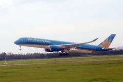 Máy bay của Vietnam Airlines cất cánh tại sân bay Tân Sơn Nhất. (Ảnh: Huy Hùng/TTXVN)